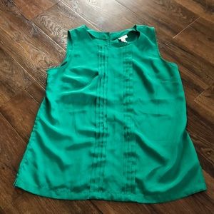 Green blouse, lightly warn, good shape.